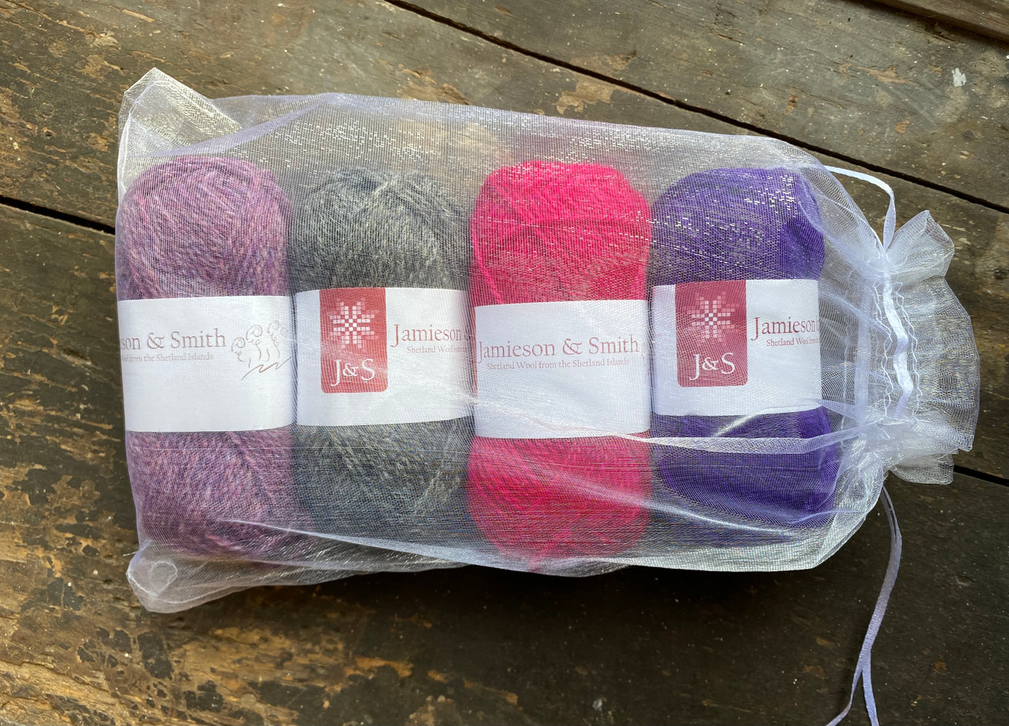 Five Round Weaving Looms with four 25g Jamieson & Smith Shetland Wool